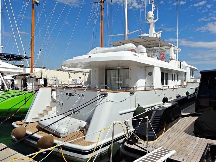 a boat docked at a pier aboard KELONIA Yacht for Sale