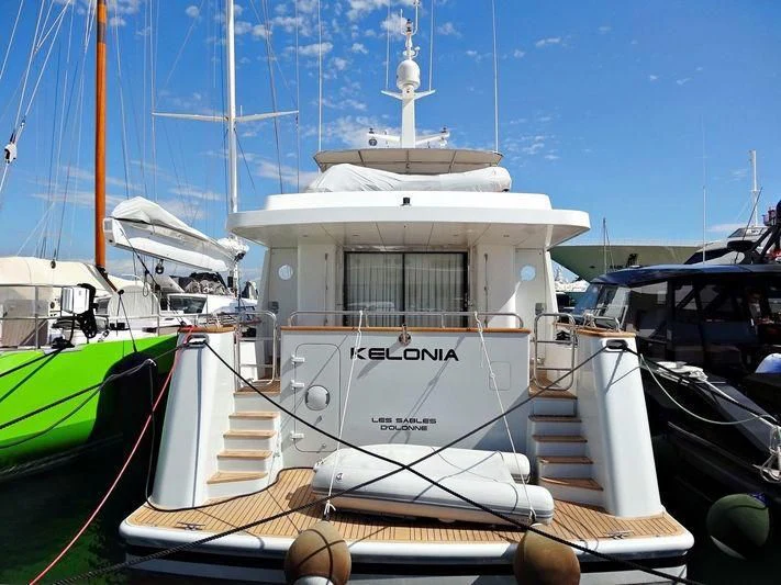 a boat docked at a pier aboard KELONIA Yacht for Sale
