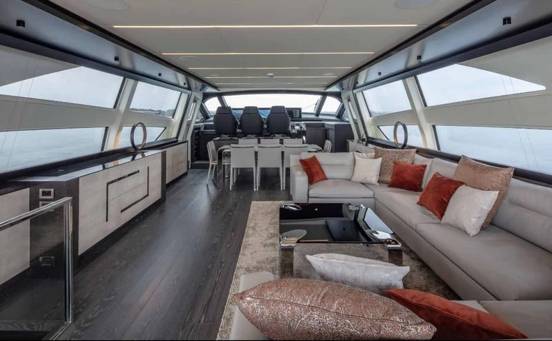 a train with a couch and a table aboard JUST 4 Yacht for Sale