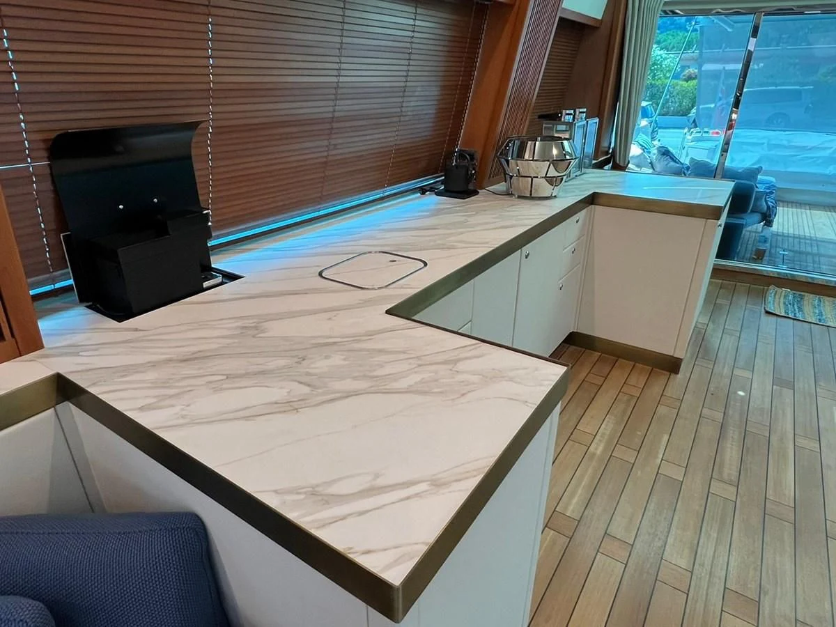 a kitchen with a wood floor aboard EYE Yacht for Sale