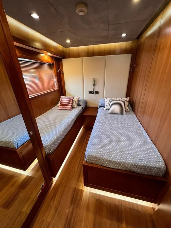 a room with bunk beds aboard EYE Yacht for Sale