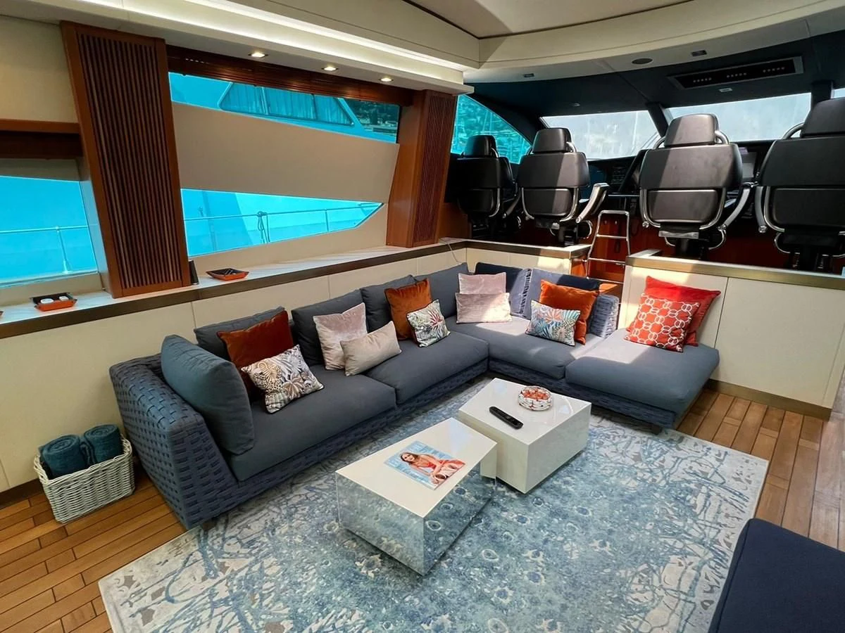 a living room with a couch and a table aboard EYE Yacht for Sale