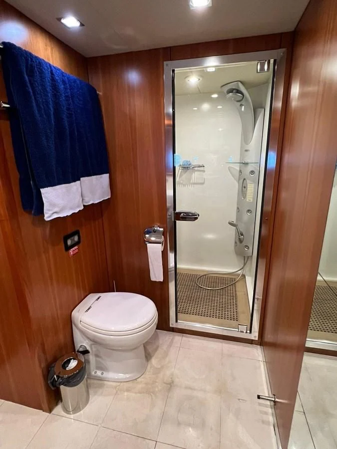 a bathroom with a glass shower aboard EYE Yacht for Sale