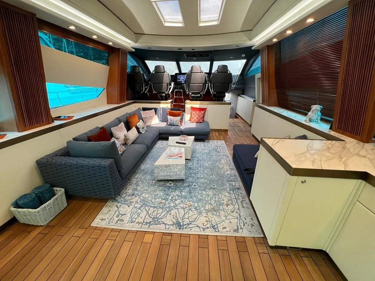 a living room with a couch and a table aboard EYE Yacht for Sale