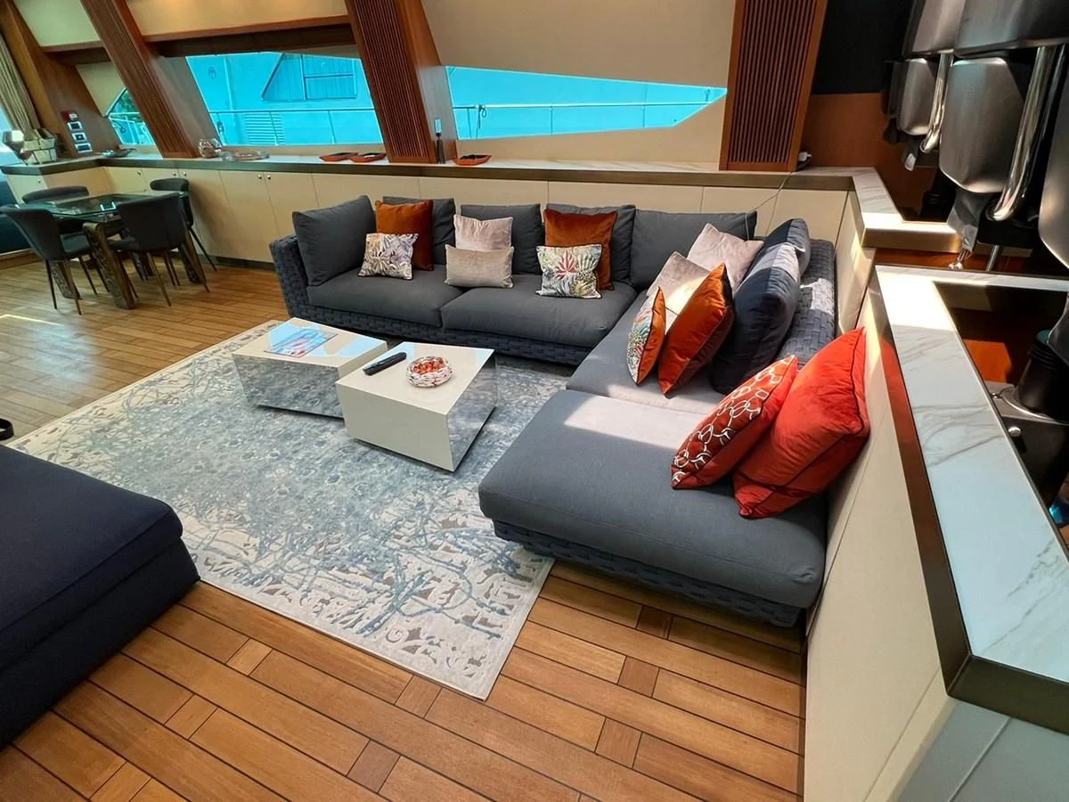 a living room with a couch and a table aboard EYE Yacht for Sale