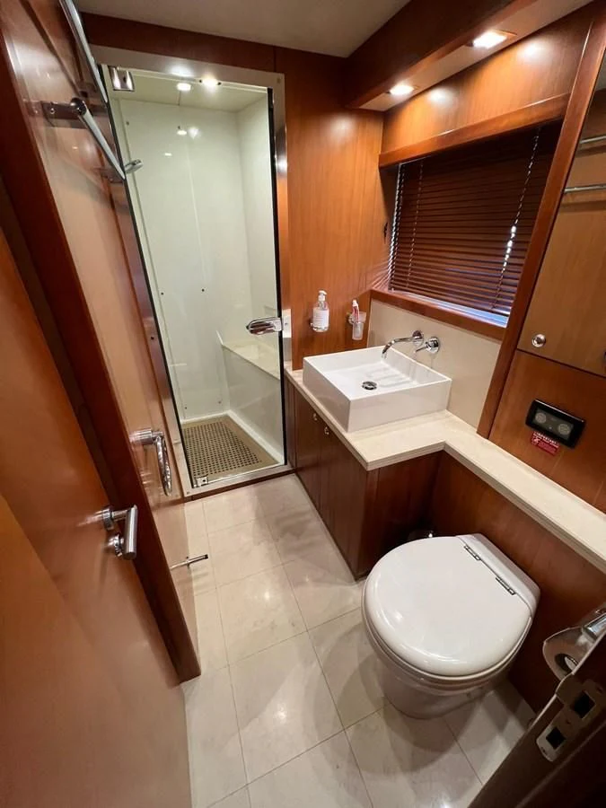 a bathroom with a toilet and sink aboard EYE Yacht for Sale