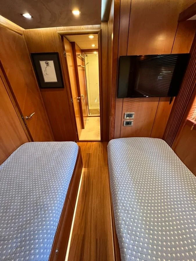 a room with a couch and television aboard EYE Yacht for Sale