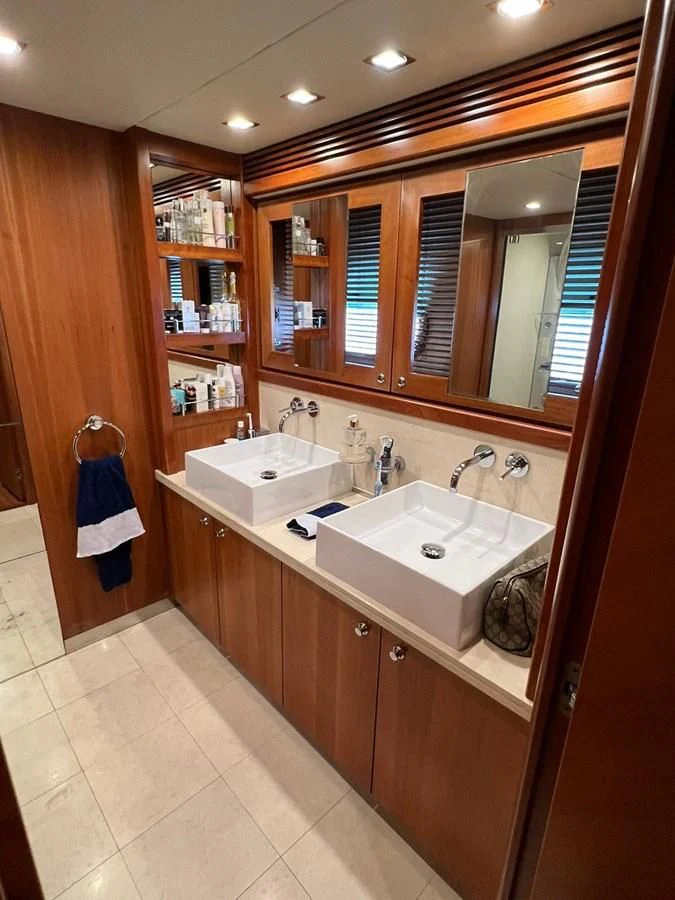 a bathroom with a sink and a mirror aboard EYE Yacht for Sale