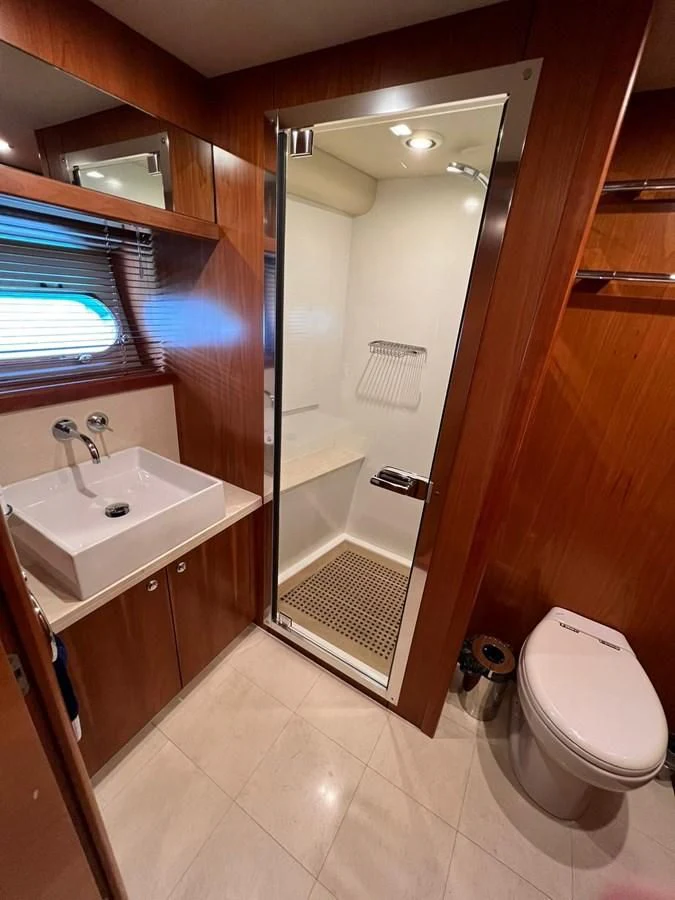 a bathroom with a shower and sink aboard EYE Yacht for Sale