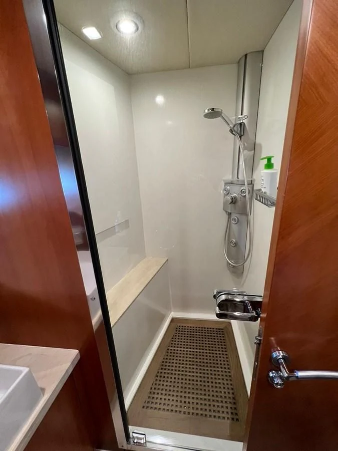a bathroom with a shower and sink aboard EYE Yacht for Sale
