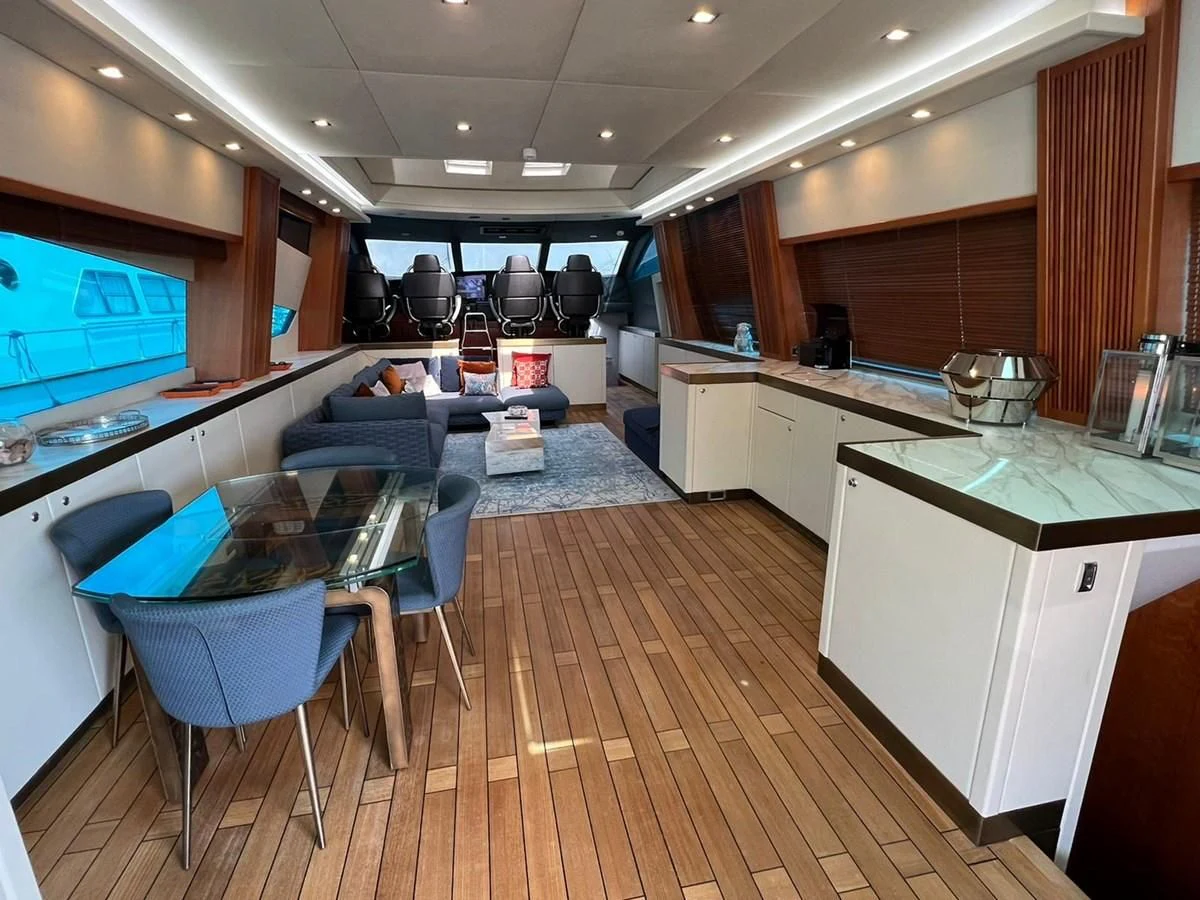 a kitchen with a wood floor aboard EYE Yacht for Sale
