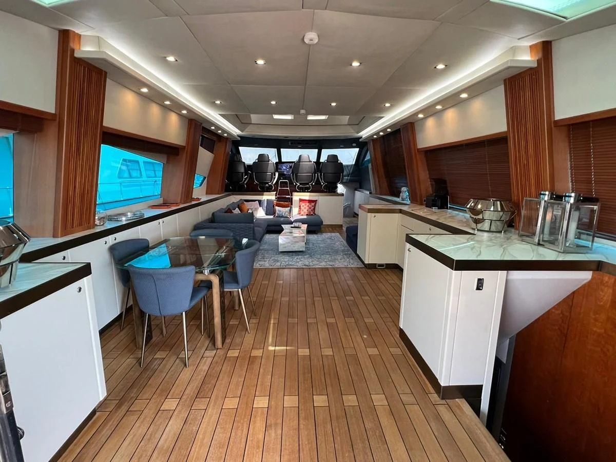 a kitchen with a wood floor aboard EYE Yacht for Sale