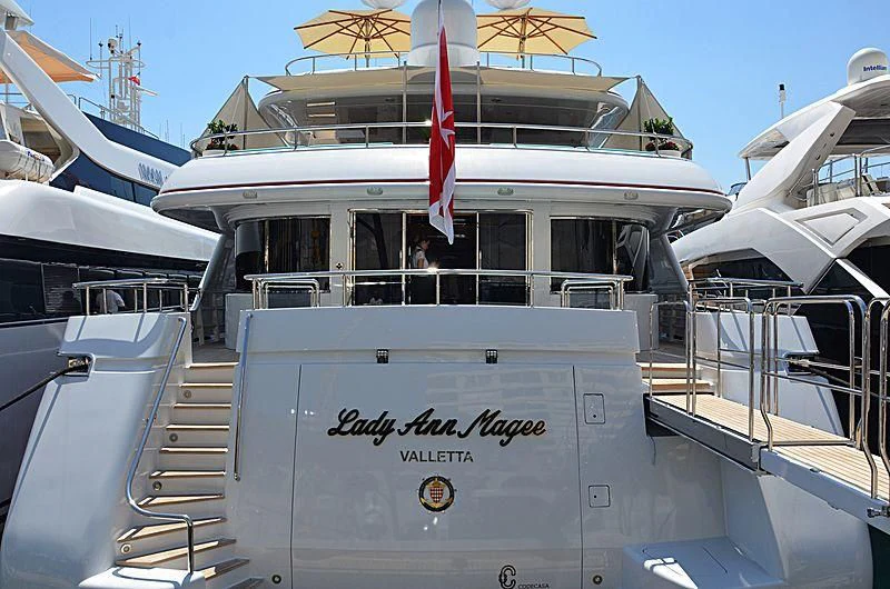 a boat with a flag on the front aboard LADY ANN MAGEE Yacht for Sale