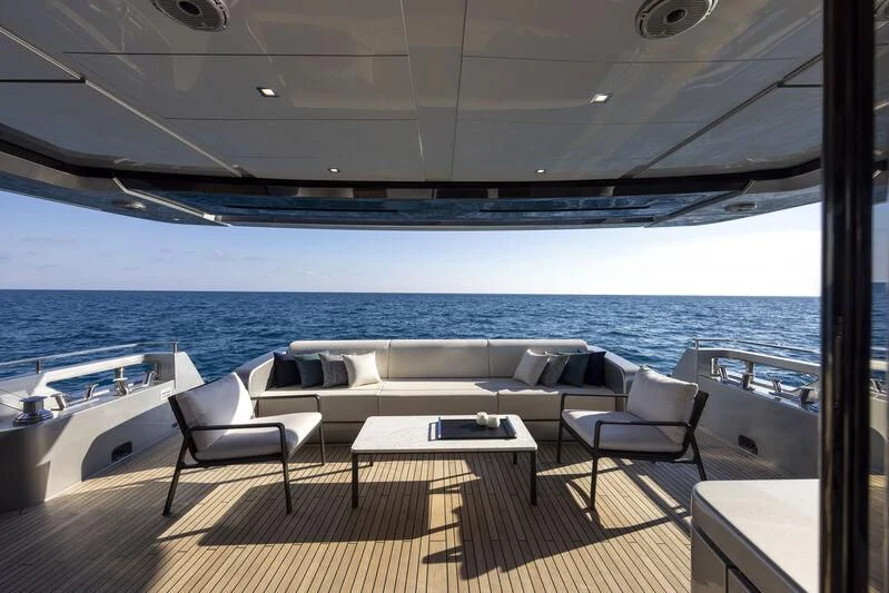 a room with a table and chairs aboard GIO4 Yacht for Sale