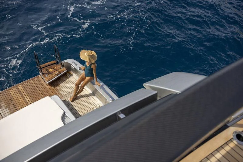 a person in a bikini on a boat aboard GIO4 Yacht for Sale