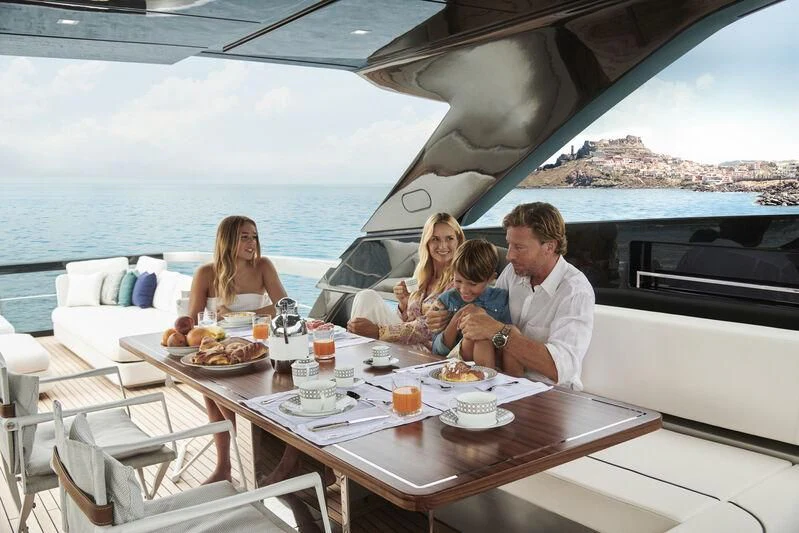 a family having a meal on a yacht aboard GIO4 Yacht for Sale