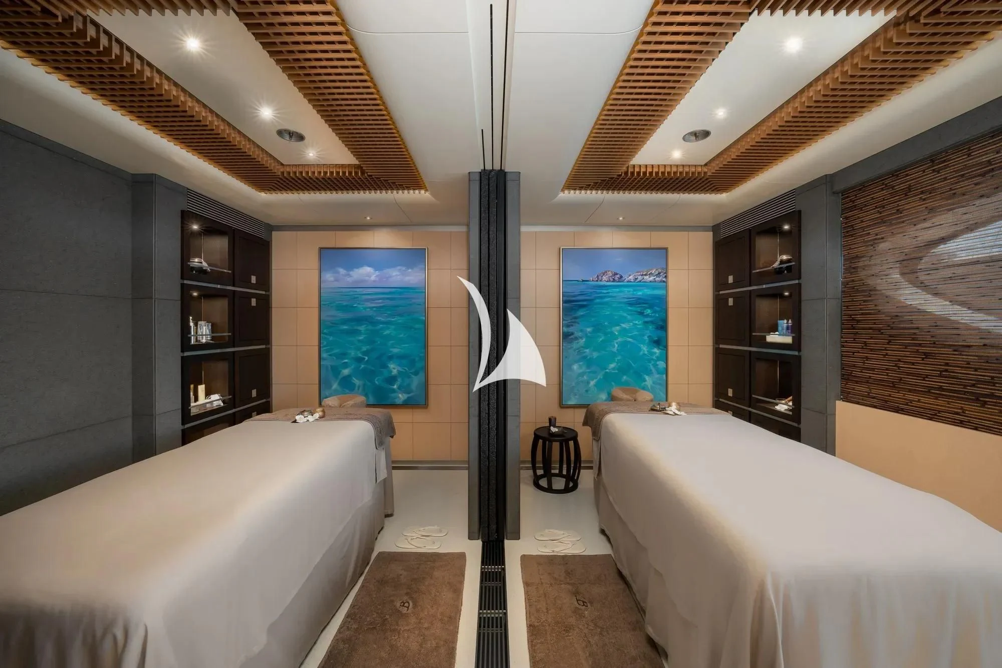 a bedroom with a bed and a lamp aboard BARBARA Yacht for Charter