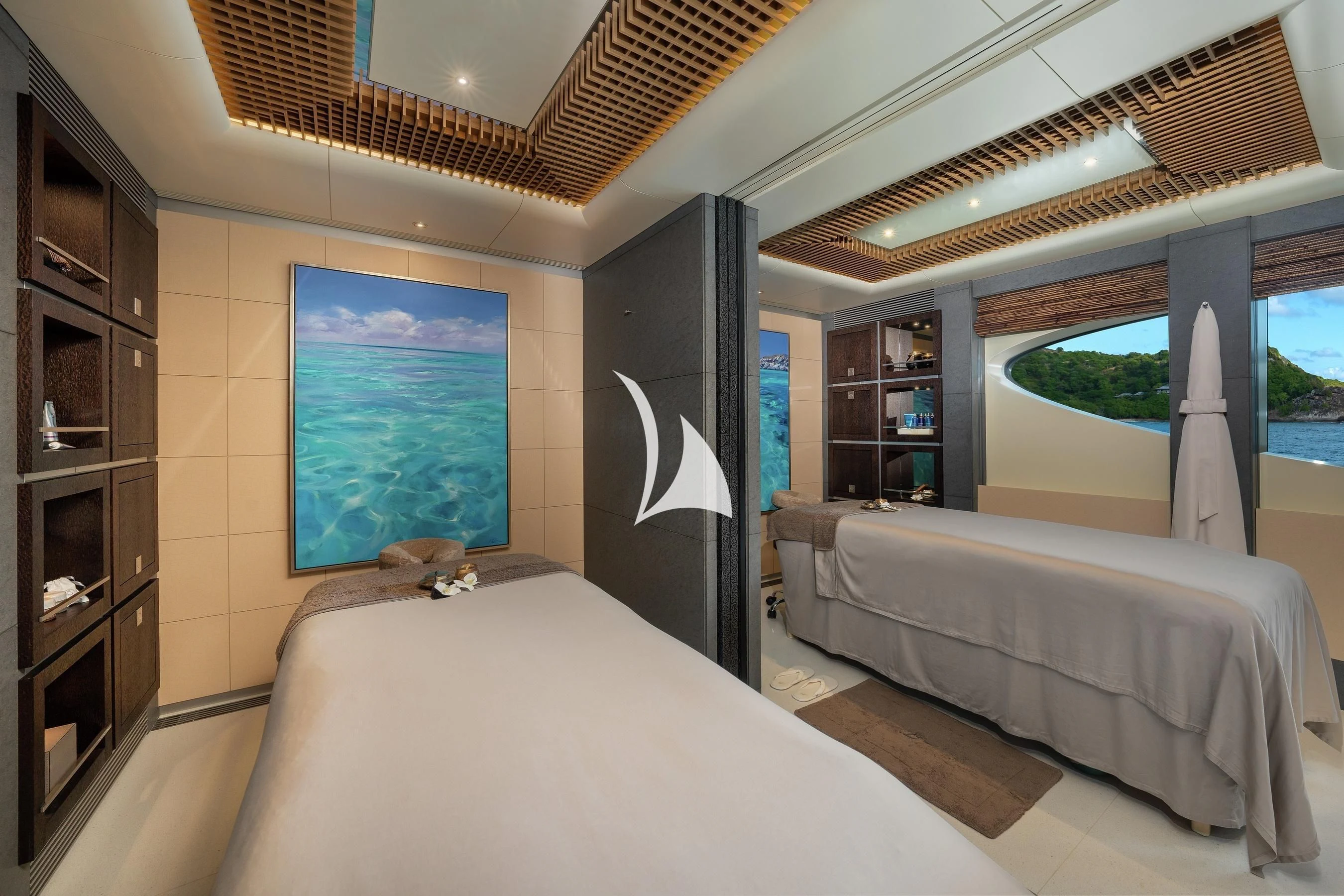 a bedroom with two beds aboard BARBARA Yacht for Charter