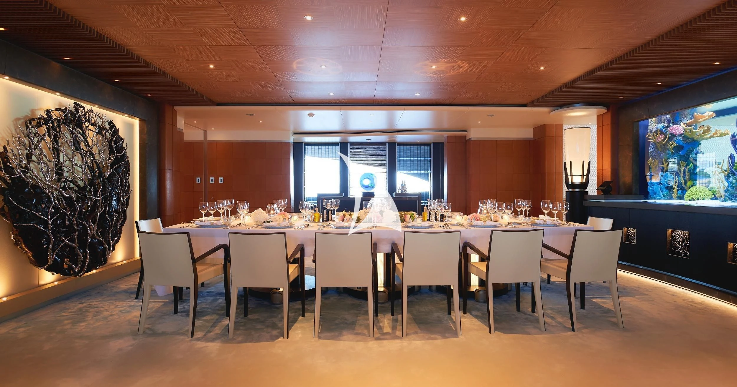 a large dining room with a large table and chairs aboard BARBARA Yacht for Charter
