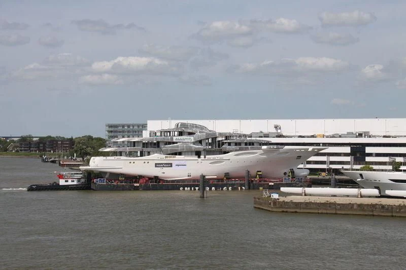 a large ship docked at a port aboard BARBARA Yacht for Charter