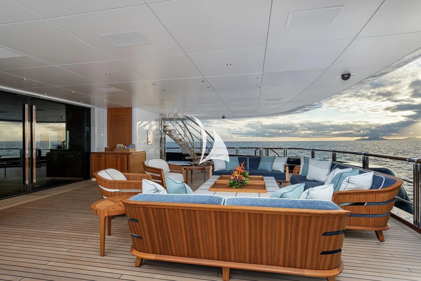 a room with a view of the ocean and the deck aboard BARBARA Yacht for Charter