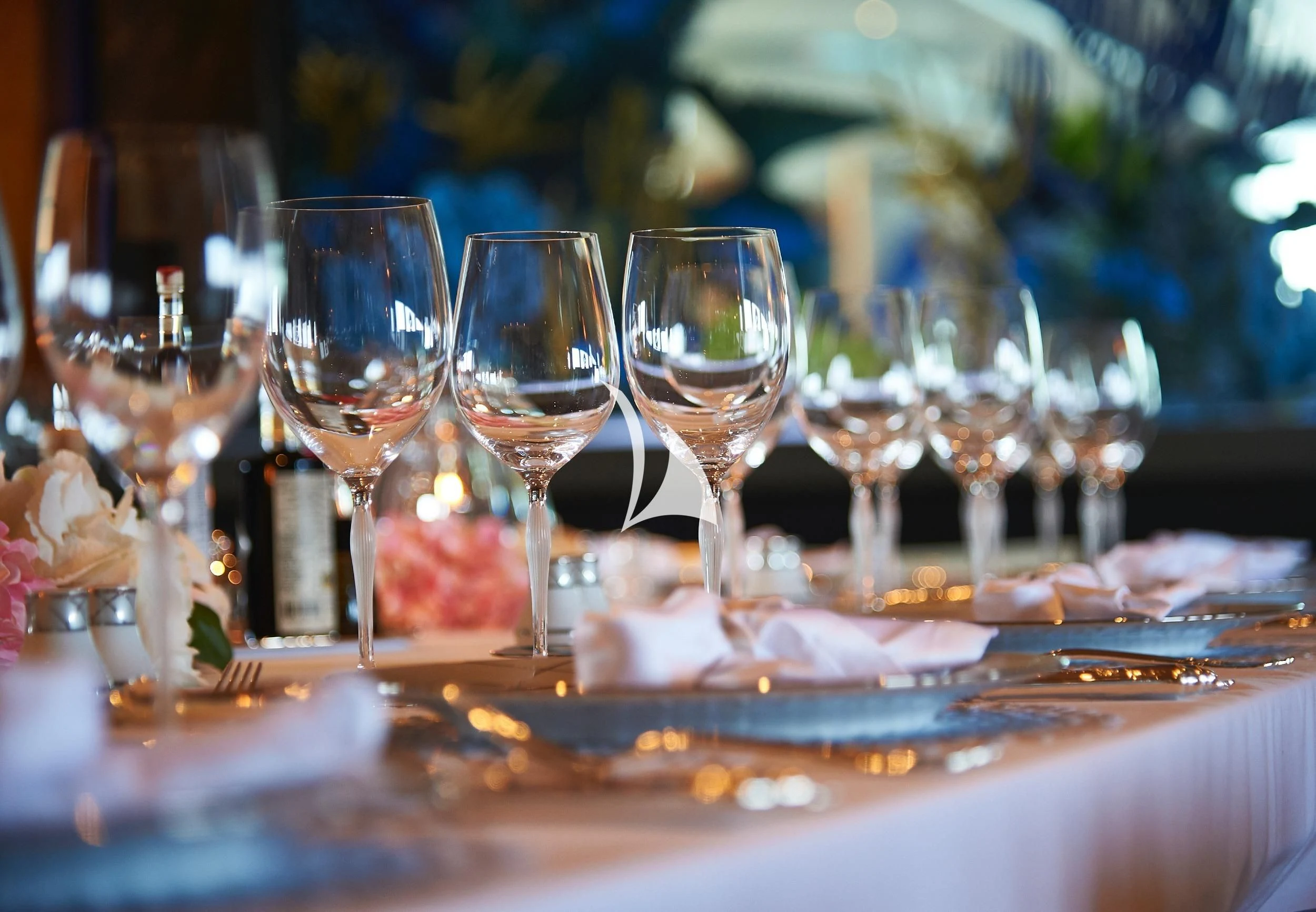 a group of wine glasses on a table aboard BARBARA Yacht for Charter