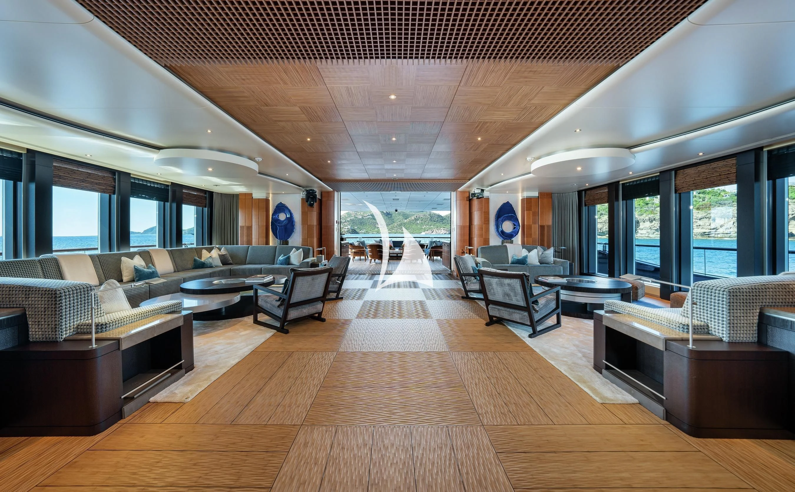 a large living room with a wood floor aboard BARBARA Yacht for Charter