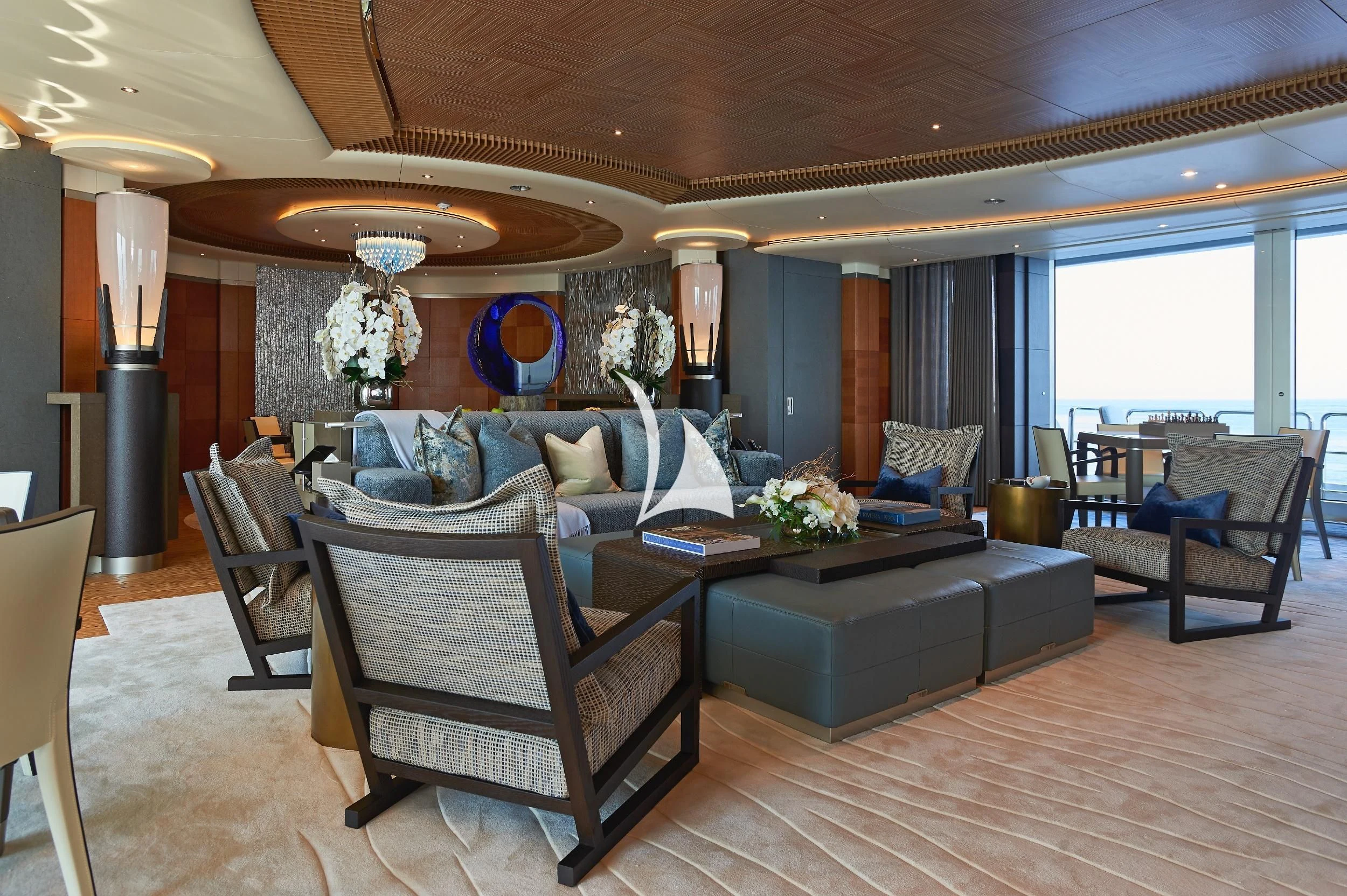 a living room with a large chandelier aboard BARBARA Yacht for Charter