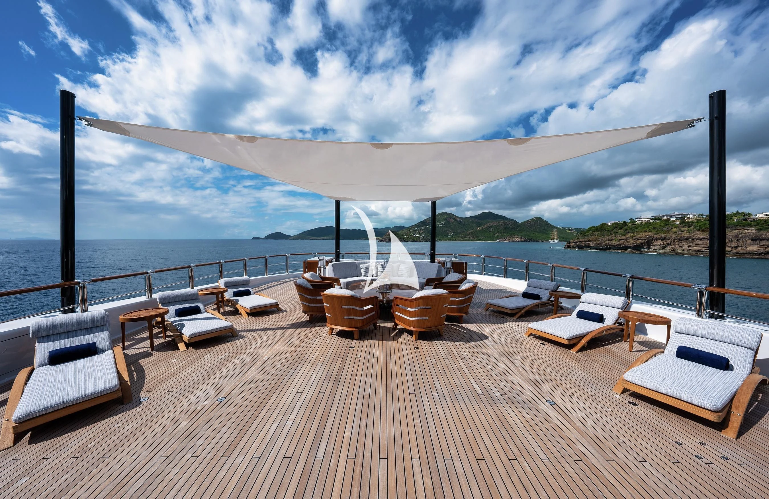 a deck with lounge chairs on it aboard BARBARA Yacht for Charter