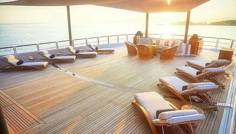 a deck with chairs and tables on it aboard BARBARA Yacht for Charter