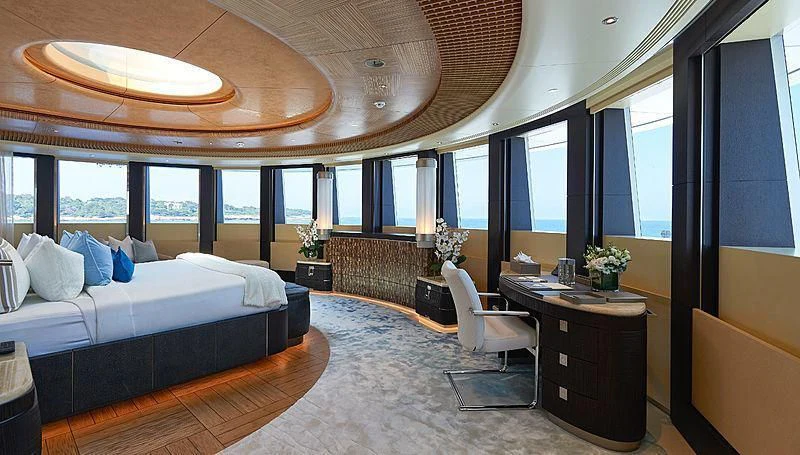 a room with a bed and a desk aboard BARBARA Yacht for Charter