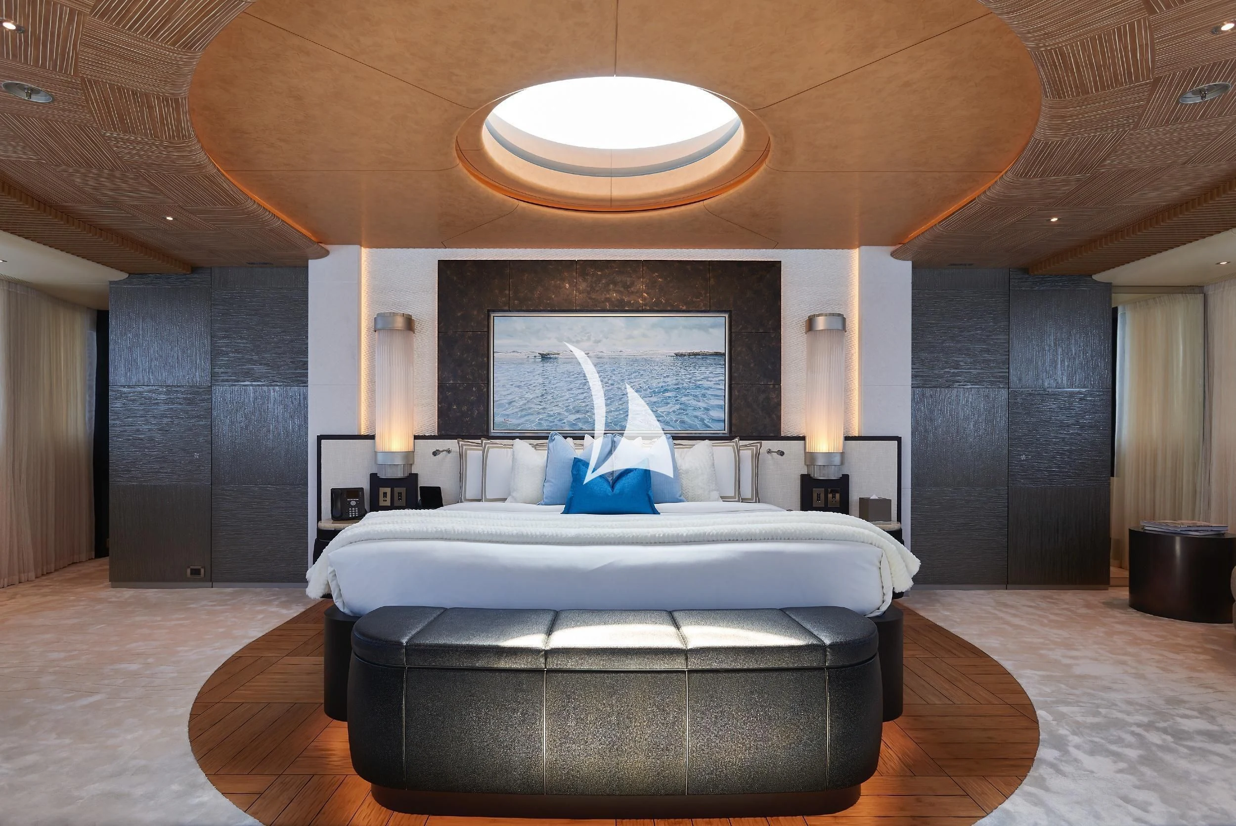 a person sitting on a bed aboard BARBARA Yacht for Charter