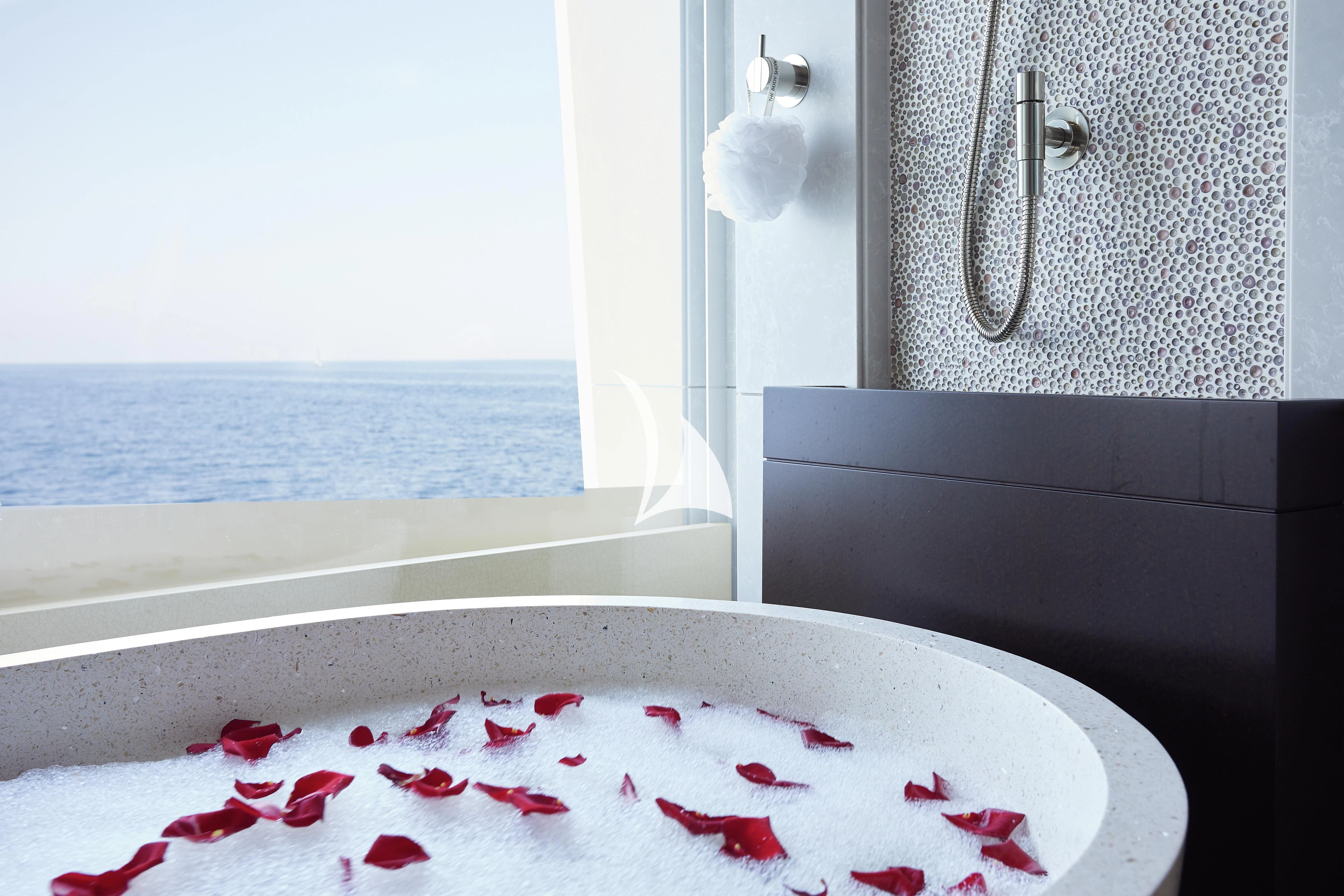 a bathtub with red and white water and red liquid aboard BARBARA Yacht for Charter
