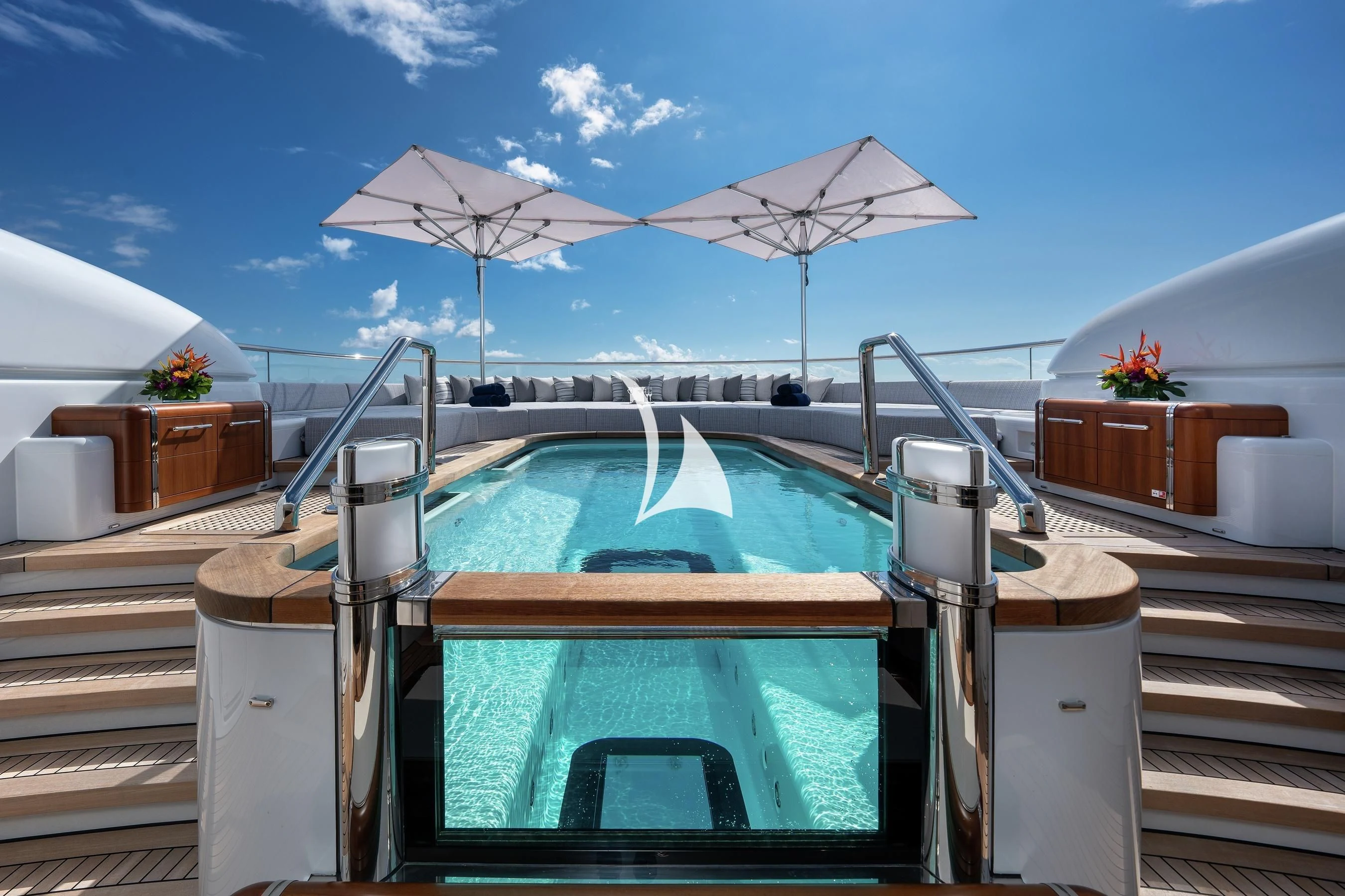 a pool with a table and chairs aboard BARBARA Yacht for Charter
