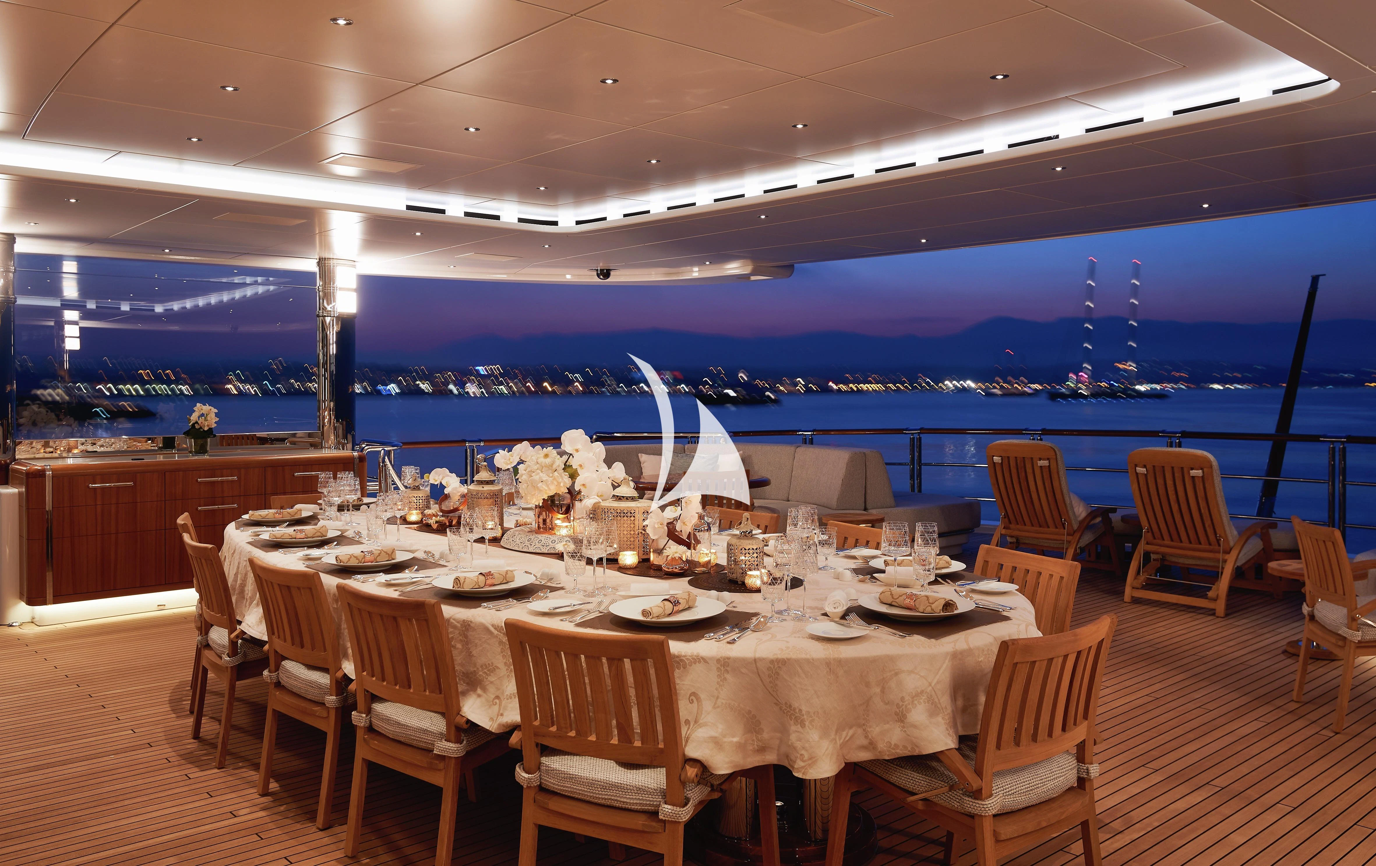 a table set for a dinner party aboard BARBARA Yacht for Charter