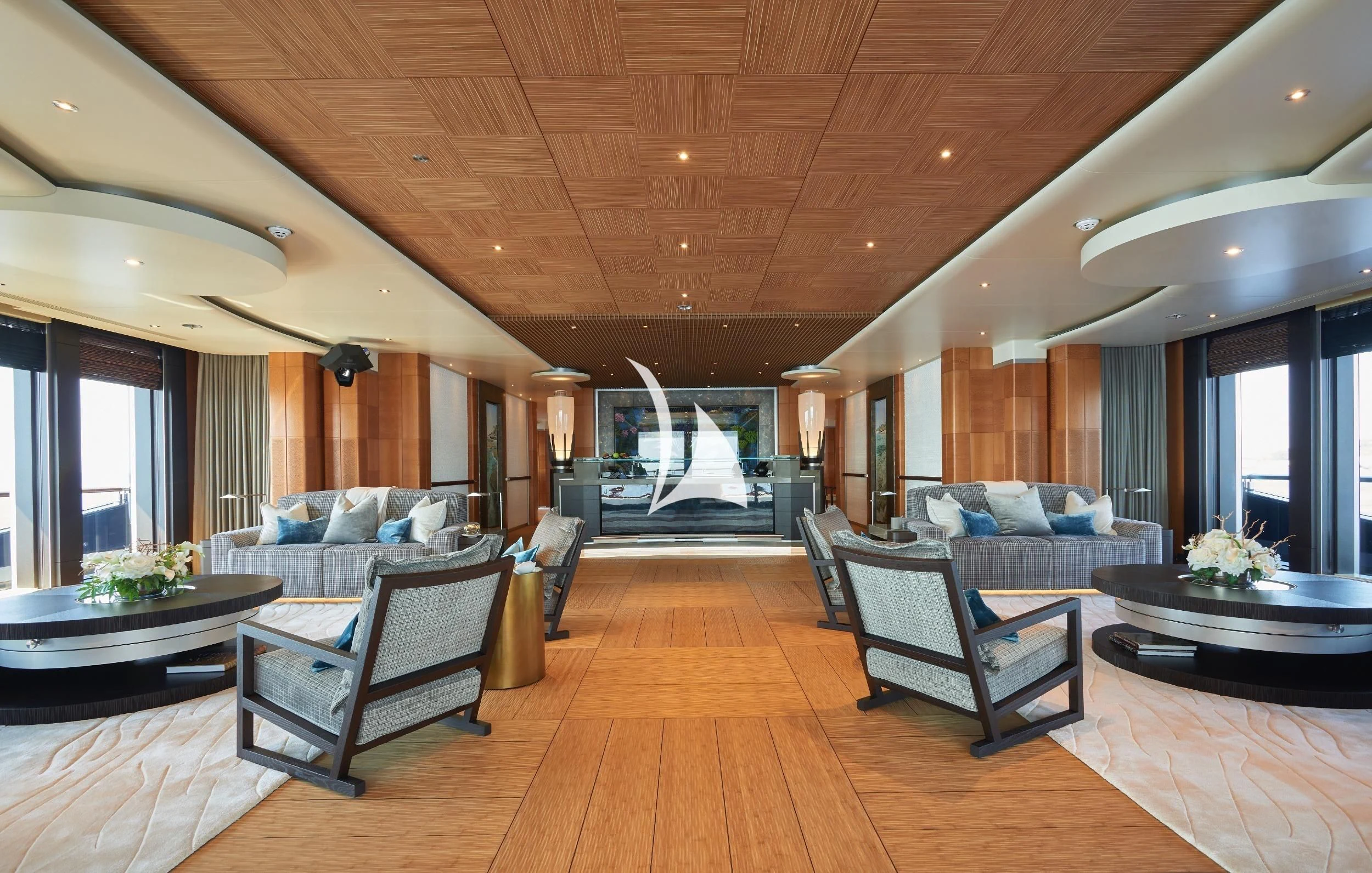 a living room with a large screen aboard BARBARA Yacht for Charter