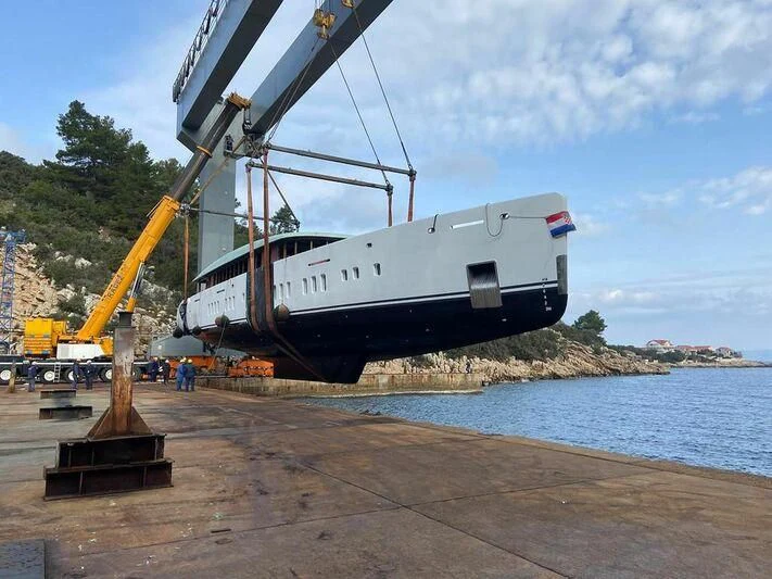 a large white boat on a dock aboard ADRI Yacht for Charter