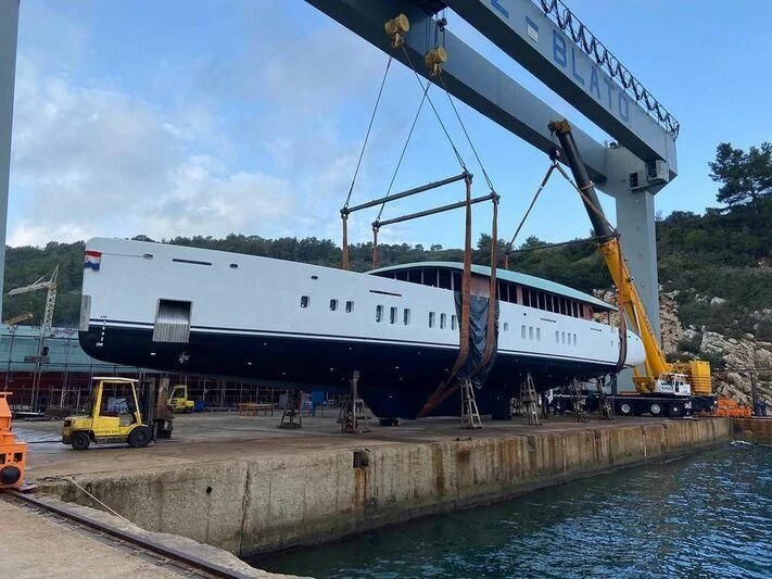 a large white boat on a dock aboard ADRI Yacht for Charter