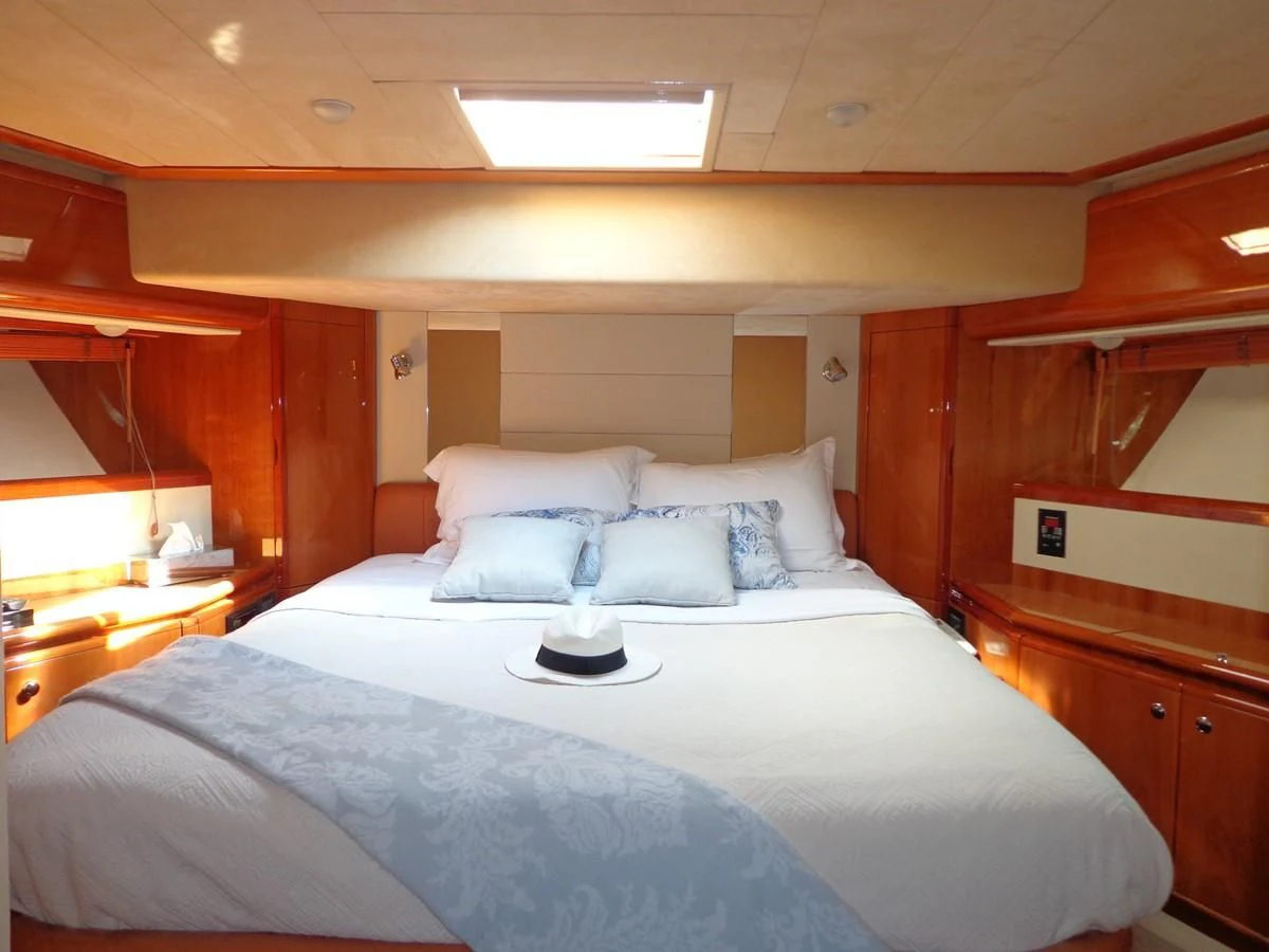 a bed with white sheets aboard FERRETTI 760 Yacht for Sale