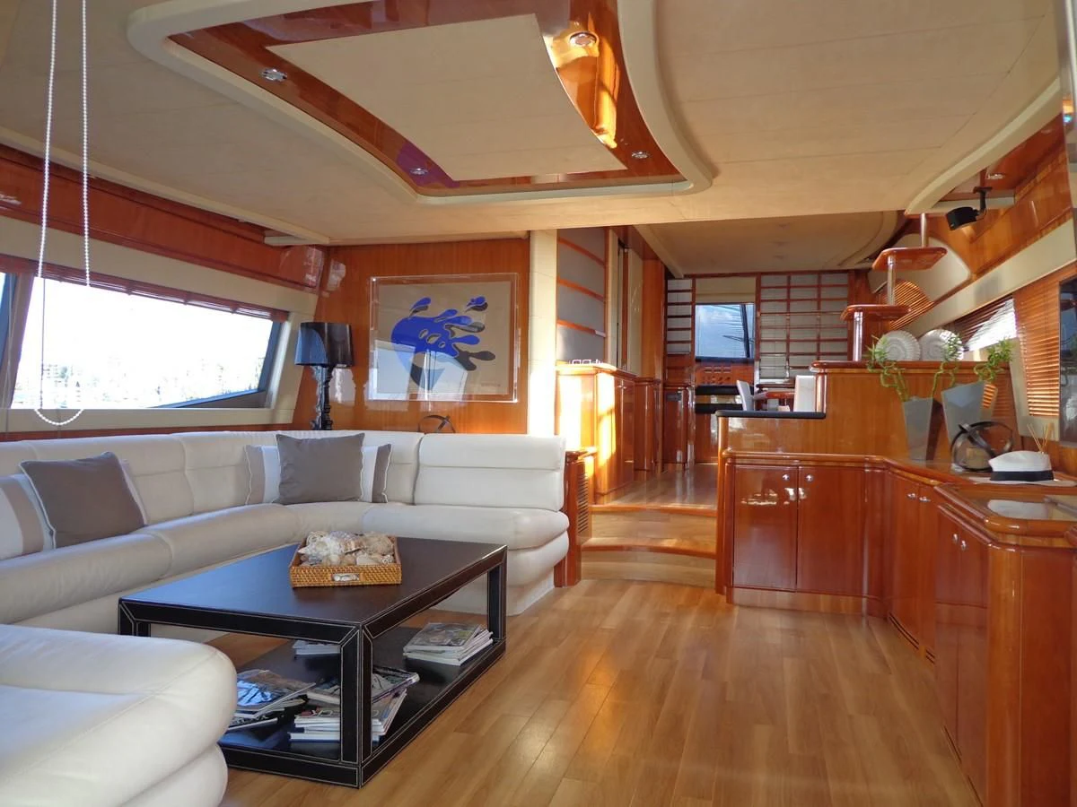 a living room with a wood floor aboard FERRETTI 760 Yacht for Sale