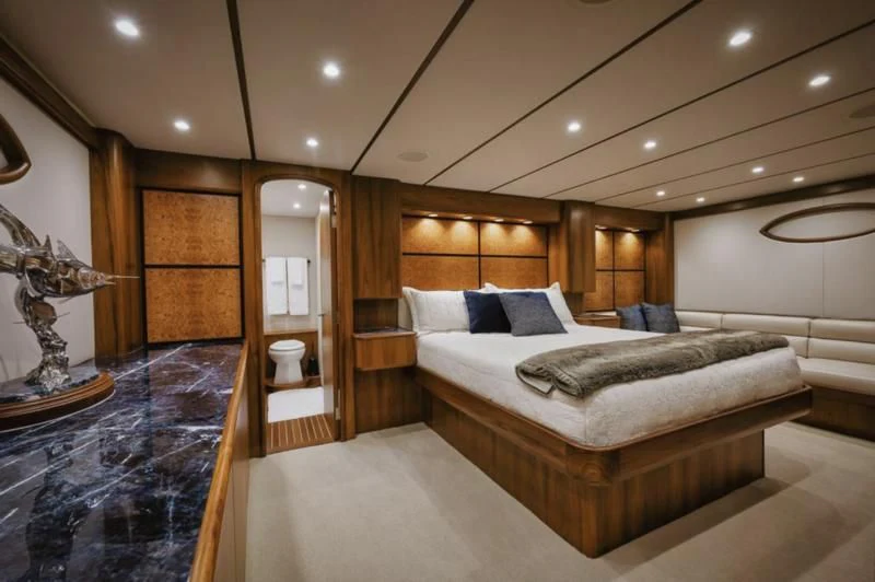 a large room with a bed and a mirror aboard SIMPATICO Yacht for Sale
