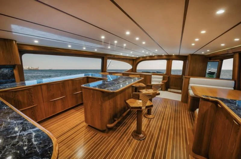 a room with a table and chairs aboard SIMPATICO Yacht for Sale