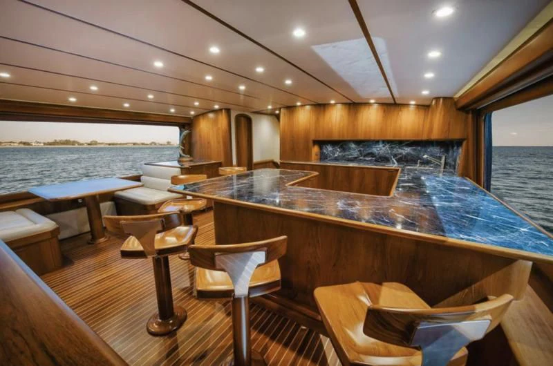 a large wooden boat in a large room with wooden walls aboard SIMPATICO Yacht for Sale