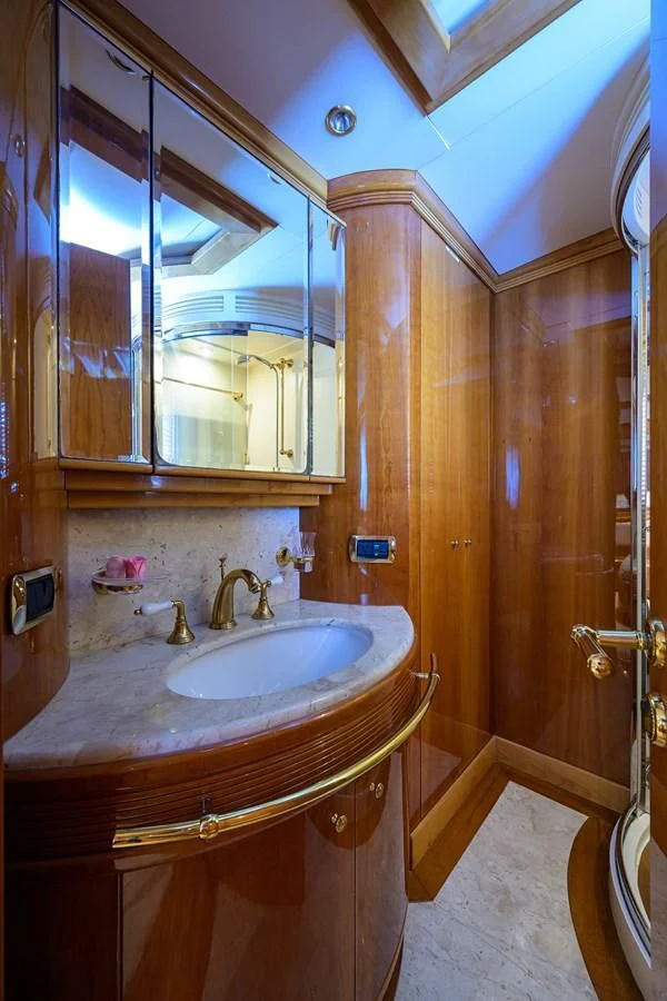 a bathroom with a sink and a mirror aboard AVA Yacht for Sale