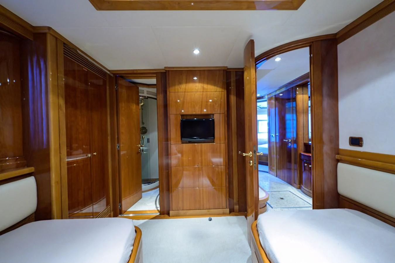 a room with a bed and a television aboard AVA Yacht for Sale
