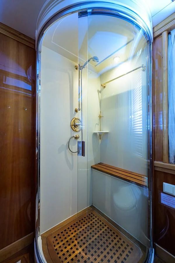 a bathroom with a glass shower aboard AVA Yacht for Sale