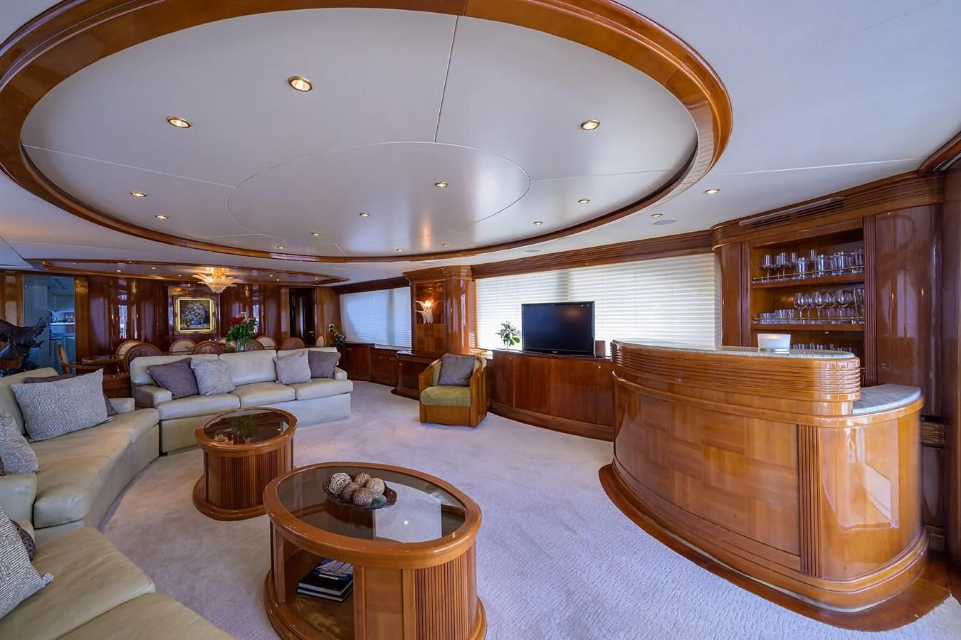 a large living room with a large open bookcase aboard AVA Yacht for Sale