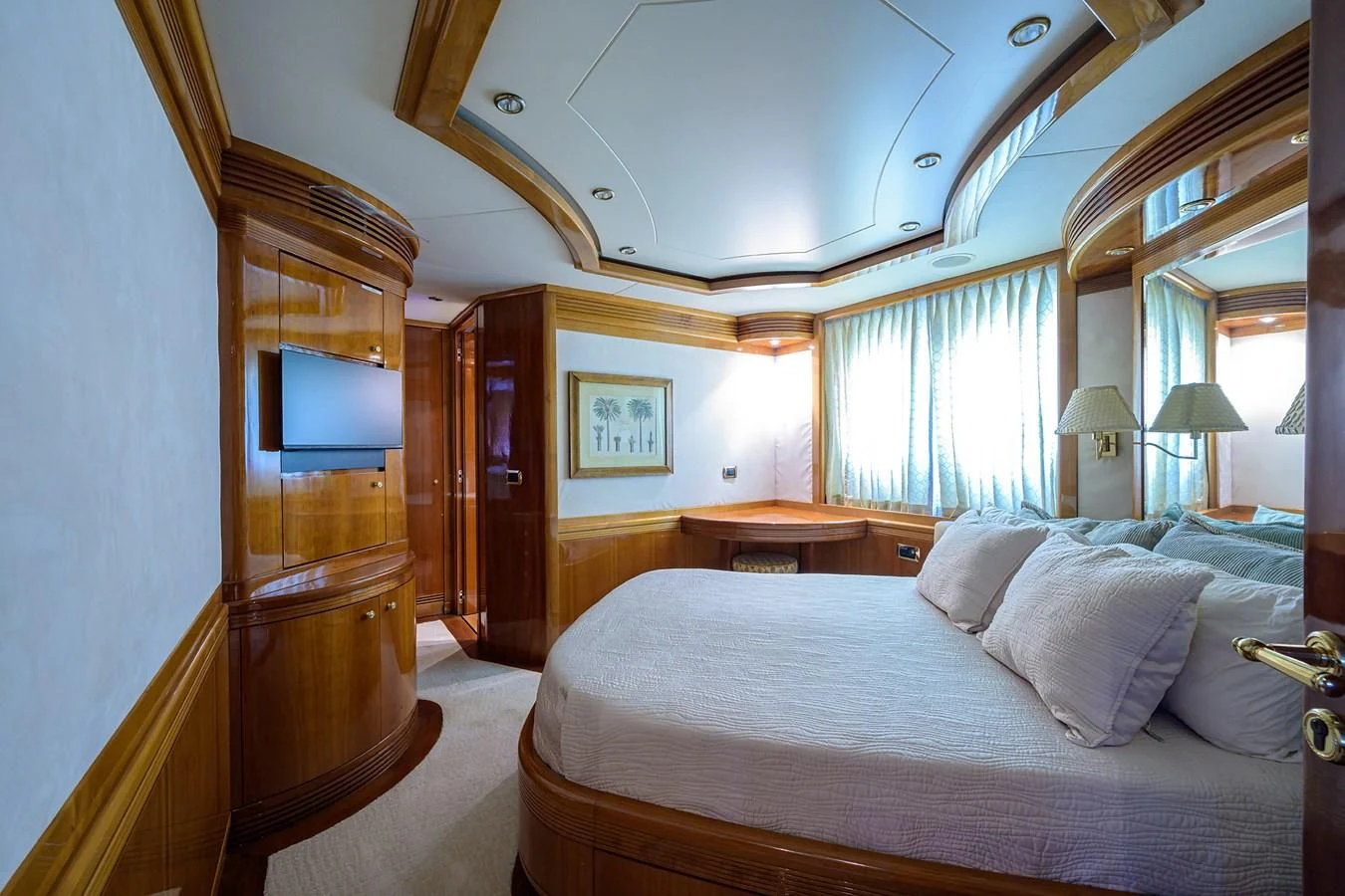 a bedroom with a bed and a television aboard AVA Yacht for Sale