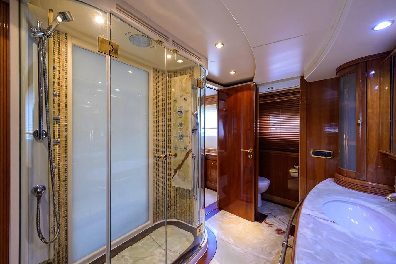 a bathroom with a tub and shower aboard AVA Yacht for Sale