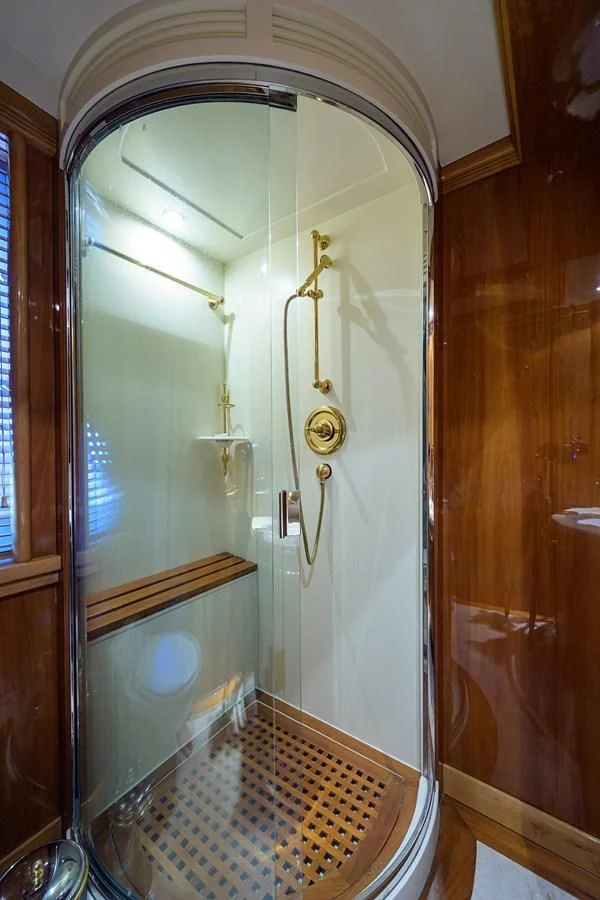 a bathroom with a large mirror aboard AVA Yacht for Sale